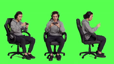 Asian-guy-sits-in-chair-over-greenscreen